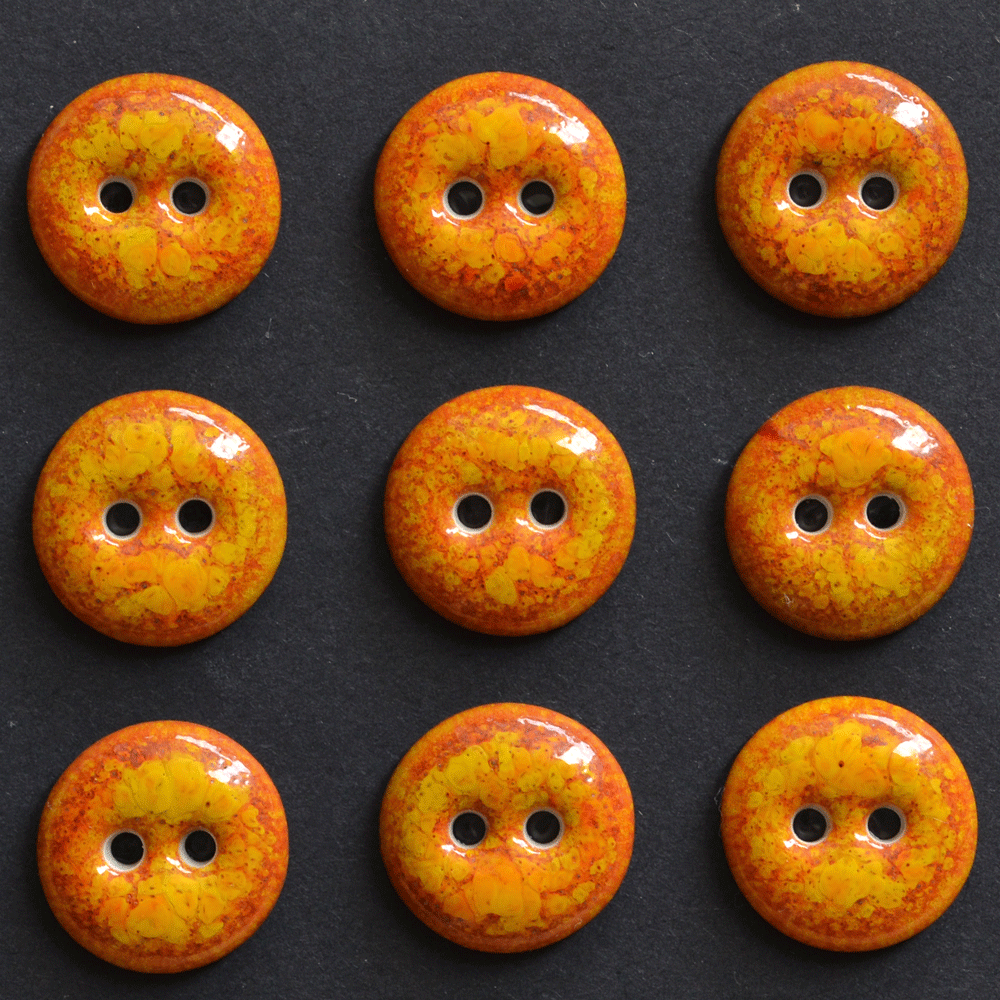 9 pcs. 15-16mm porcelain buttons glowing orange