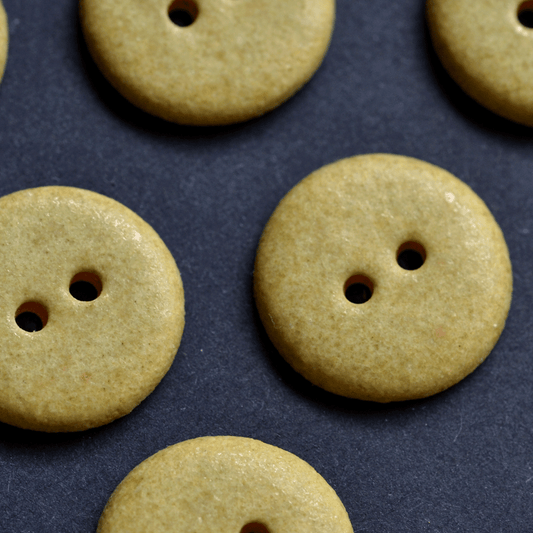 9 pcs. 15/16mm ceramic buttons yellow dolomite