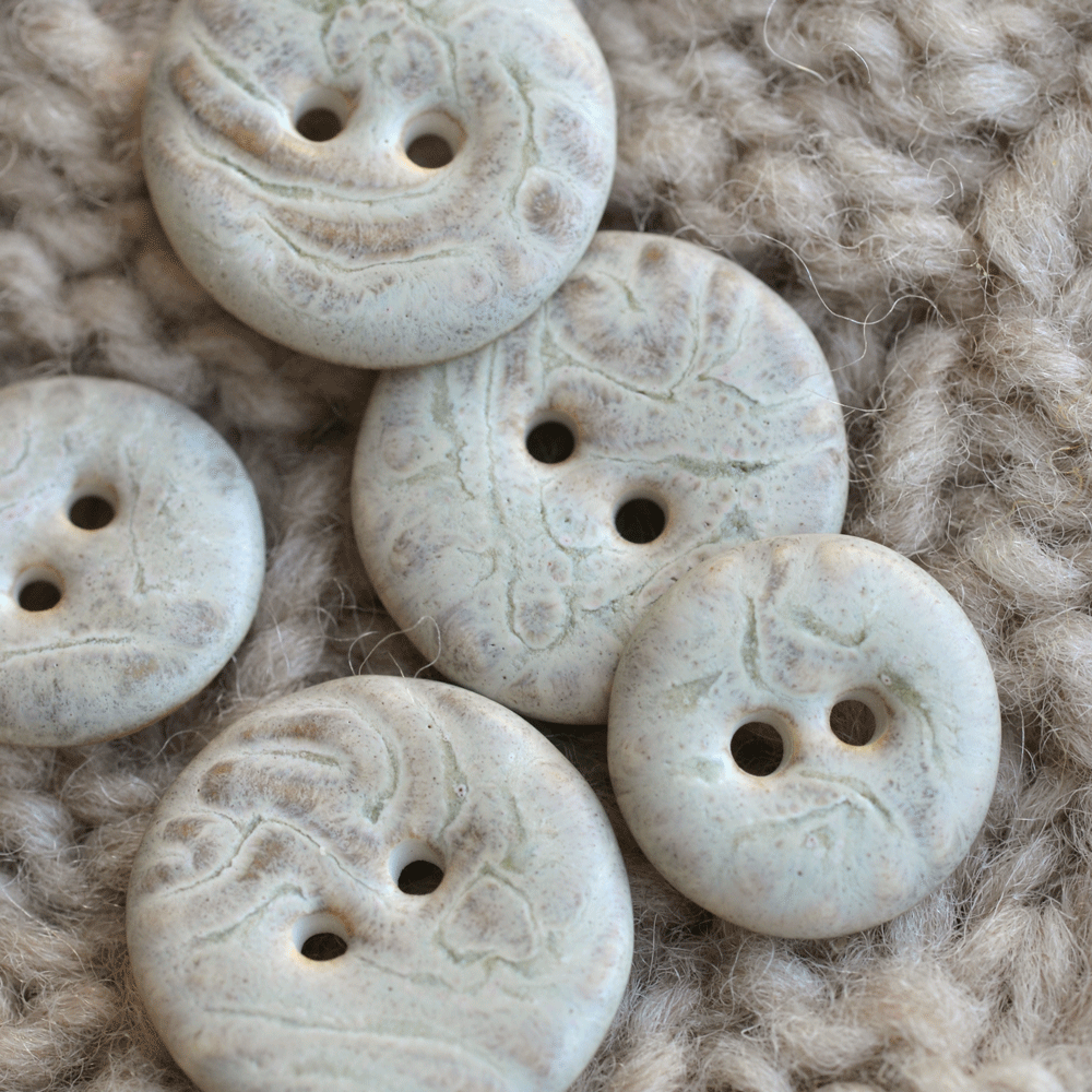 Porcelain buttons marfil
