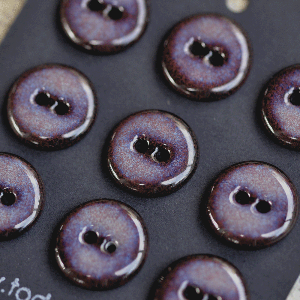 9 pcs. 17-18mm black porcelain buttons in dark lilac