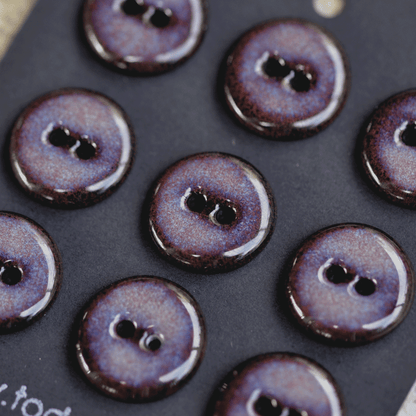 9 pcs. 17-18mm black porcelain buttons in dark lilac