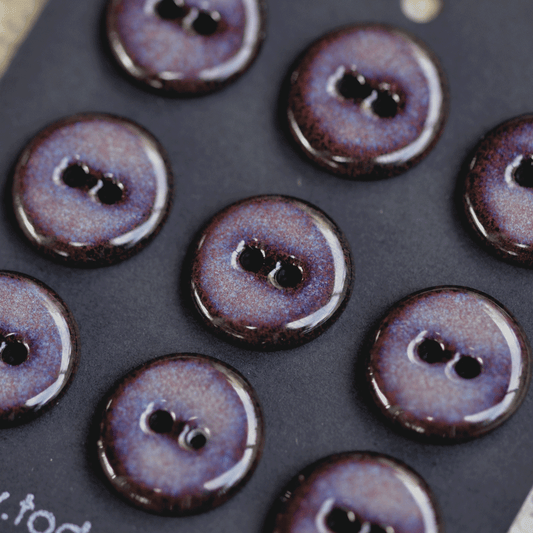 9 pcs. 17-18mm black porcelain buttons in dark lilac