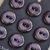 9 pcs. 17-18mm black porcelain buttons in dark lilac