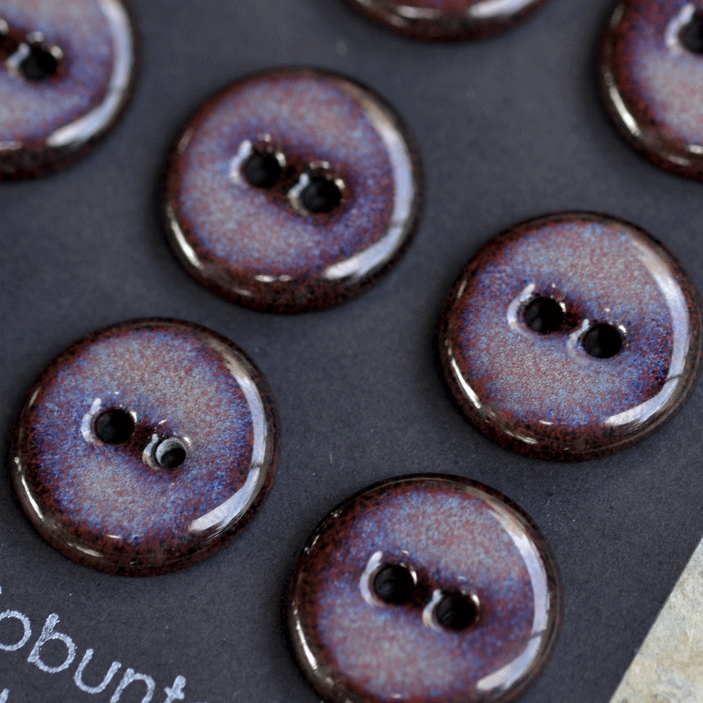9 pcs. 17-18mm black porcelain buttons in dark lilac