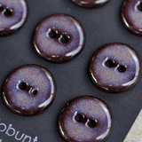 9 pcs. 17-18mm black porcelain buttons in dark lilac