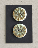 2 pcs. 22-23mm porcelain buttons with flower stamp